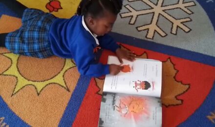 Child reading in nursery